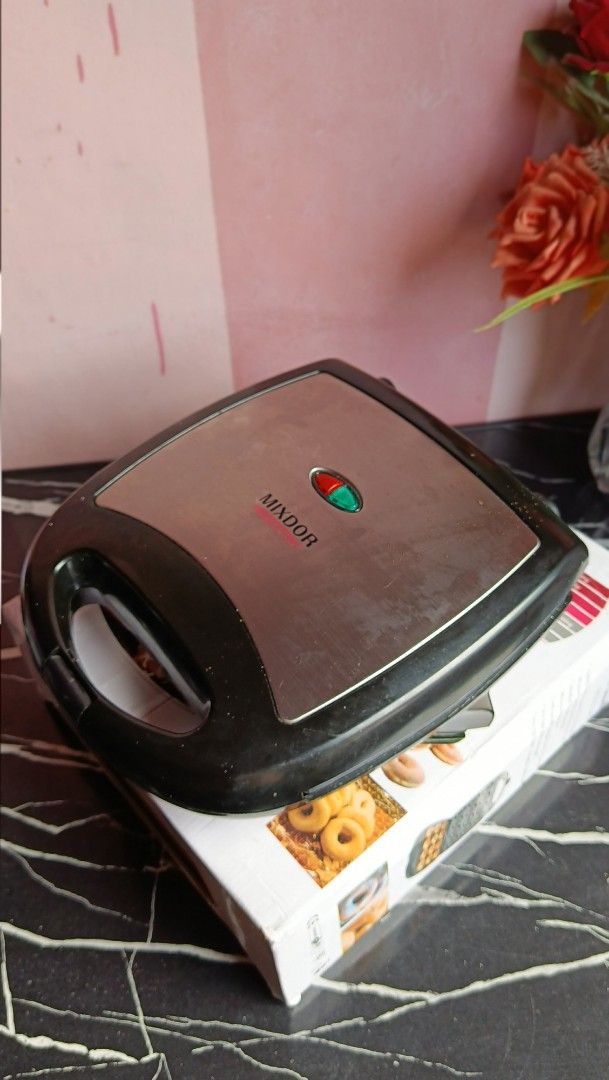 Mixdor 12 hole Donut Maker (Category: Other Kitchen Appliances) located in Quezon City. Submitted by _itsmemarie_ (Listing ID 1439295676, Image 3). Description: ✨ 12-Hole Doughnut Maker – Almost New! ✨ Selling my 12-hole doughnut maker, only used 3 times and still in excellent condition. Perfect for making mini donuts quickly and easily at home — great for snacks, small businesses, or family bonding! 🍩 ✅ Makes 12 donuts at once ✅ Fast heating & 