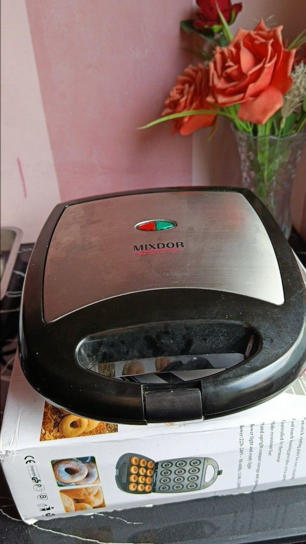 Mixdor 12 hole Donut Maker (Category: Other Kitchen Appliances) located in Quezon City. Submitted by _itsmemarie_ (Listing ID 1439295676, Image 1). Description: ✨ 12-Hole Doughnut Maker – Almost New! ✨ Selling my 12-hole doughnut maker, only used 3 times and still in excellent condition. Perfect for making mini donuts quickly and easily at home — great for snacks, small businesses, or family bonding! 🍩 ✅ Makes 12 donuts at once ✅ Fast heating & 