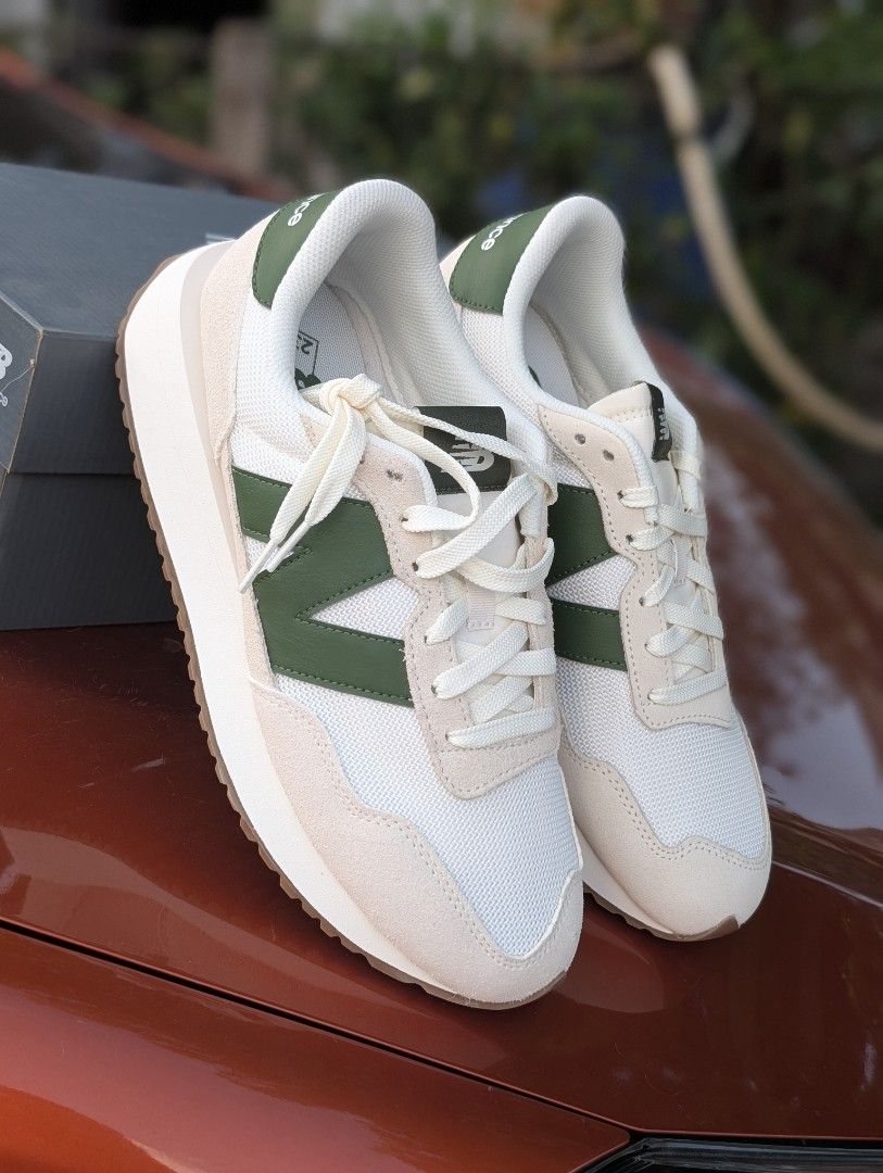 New Balance 237 Sneakers - White/Green (Category: Sneakers) located in Quezon City. Submitted by watchalternativeph (Listing ID 1439349908, Image 2). Description: - New Balance 237 - White and green colorway - Mesh upper with suede overlays - Iconic 'N' logo - Light cream sole with brown outsole - Comes with original box -Size 10US Men Available for other sizes upon request.