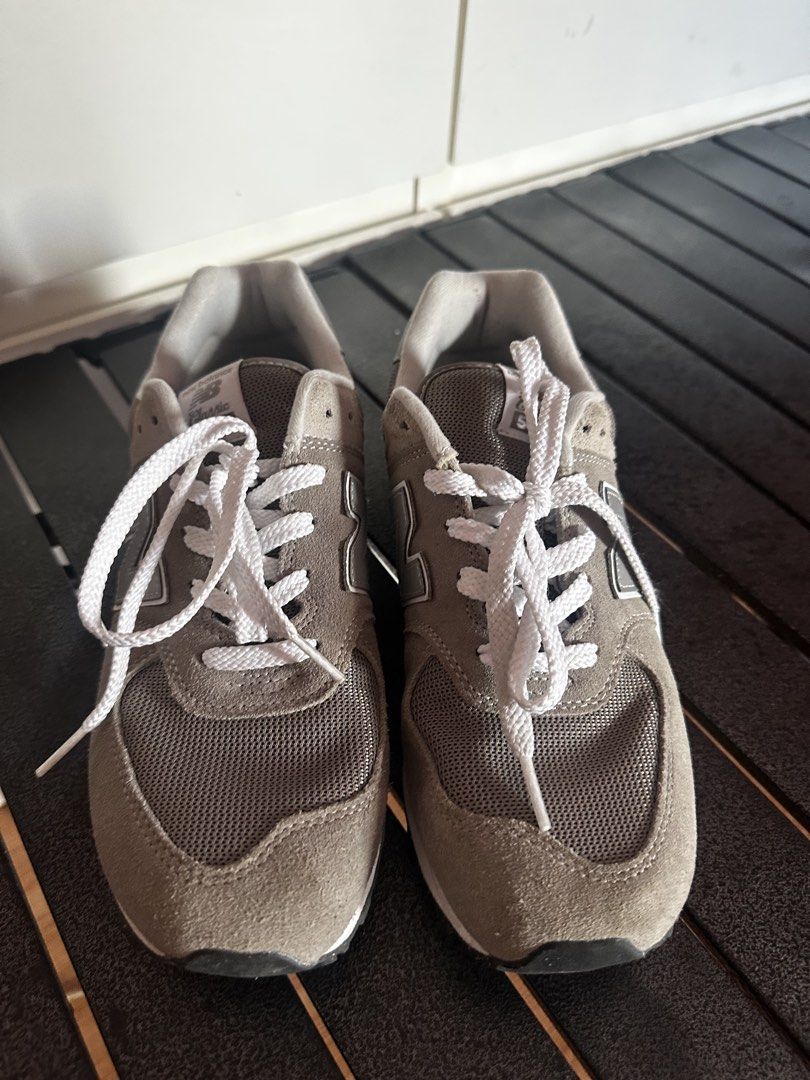New Balance 574 Gray Sneakers (Category: Sneakers) located in Manila. Submitted by marinethm31861 (Listing ID 1439308817, Image 2). Description: - New Balance 574 sneakers - Gray colorway - Iconic 'N' logo - Suede and mesh upper - White laces - 'New Balance' branding on heel - Perfect for everyday wear.