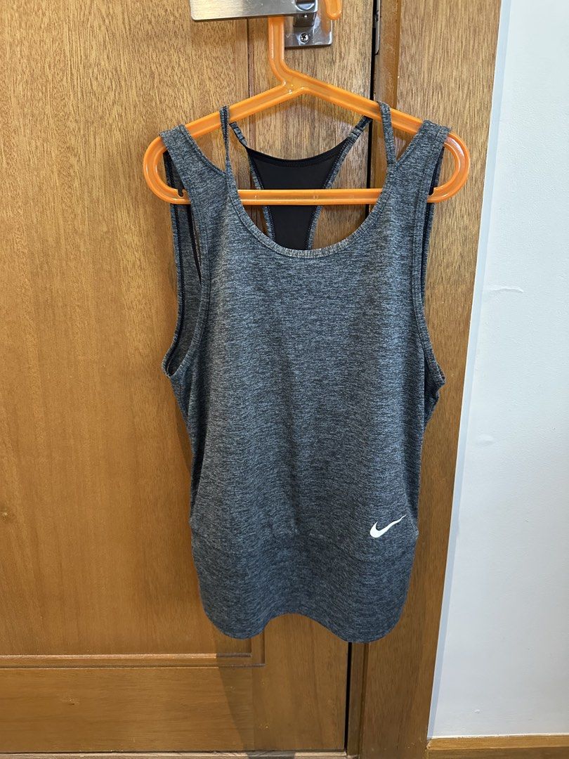 Nike Dri-FIT Tank Top - XS (Category: Activewear) located in Manila. Submitted by alemanysof97766 (Listing ID 1439307110, Image 1). Description: - Gray Nike Dri-FIT tank top - Size: XS - Built-in sports bra with black back panel - Small white Nike logo - Made in Vietnam.
