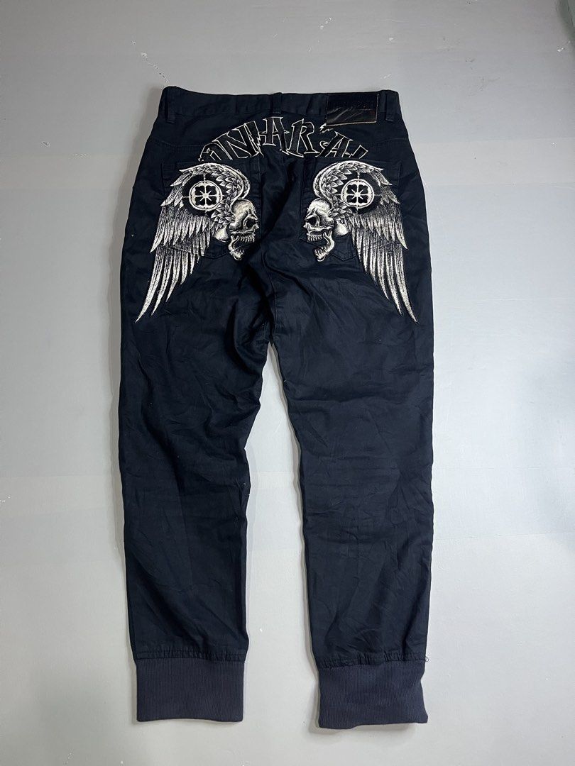 ONIARAI Skull Wing Pants (Category: Jeans) located in Mabalacat. Submitted by aas_thriftfings (Listing ID 1439342794, Image 1). Description: - ONIARAI black pants - Unique skull and wing design on the back - Size: M - Material: 100% cotton - Features: - Button closure - Pockets - Pleats - Logo detail - Ribbed cuffs.