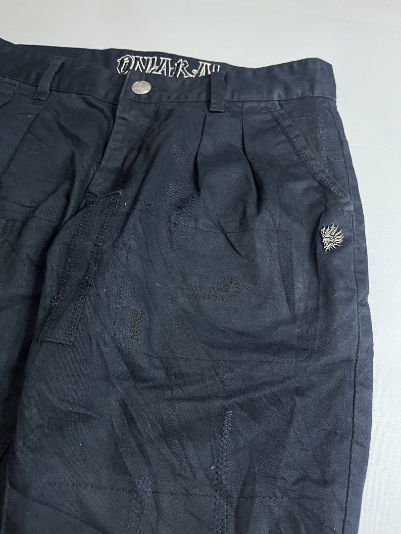 ONIARAI Skull Wing Pants (Category: Jeans) located in Mabalacat. Submitted by aas_thriftfings (Listing ID 1439342794, Image 3). Description: - ONIARAI black pants - Unique skull and wing design on the back - Size: M - Material: 100% cotton - Features: - Button closure - Pockets - Pleats - Logo detail - Ribbed cuffs.
