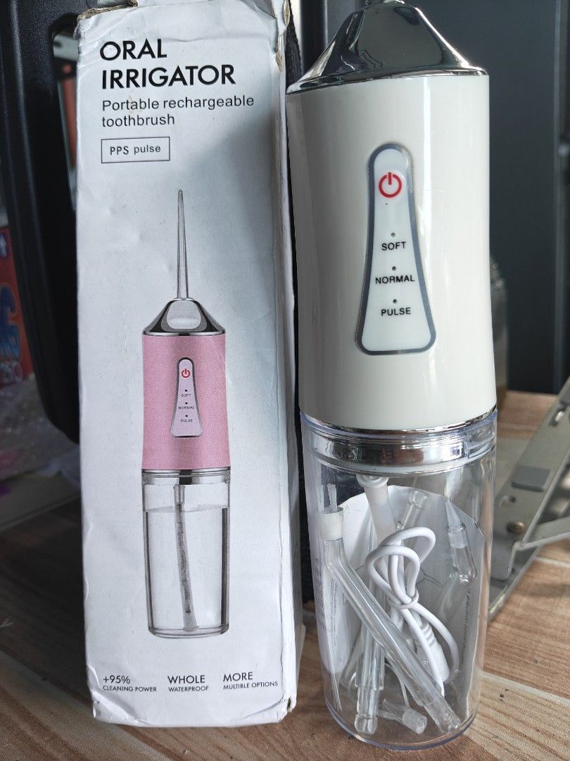 Oral Irrigator Portable Rechargeable Toothbrush (Category: Oral Care) located in Pasig City. Submitted by siyerli8 (Listing ID 1439261167, Image 1). Description: - Portable and rechargeable oral irrigator - white color - Features three modes: soft, normal, and pulse - Fully waterproof - Includes multiple tips - Comes with a charging cable loc. rosario pasig.
