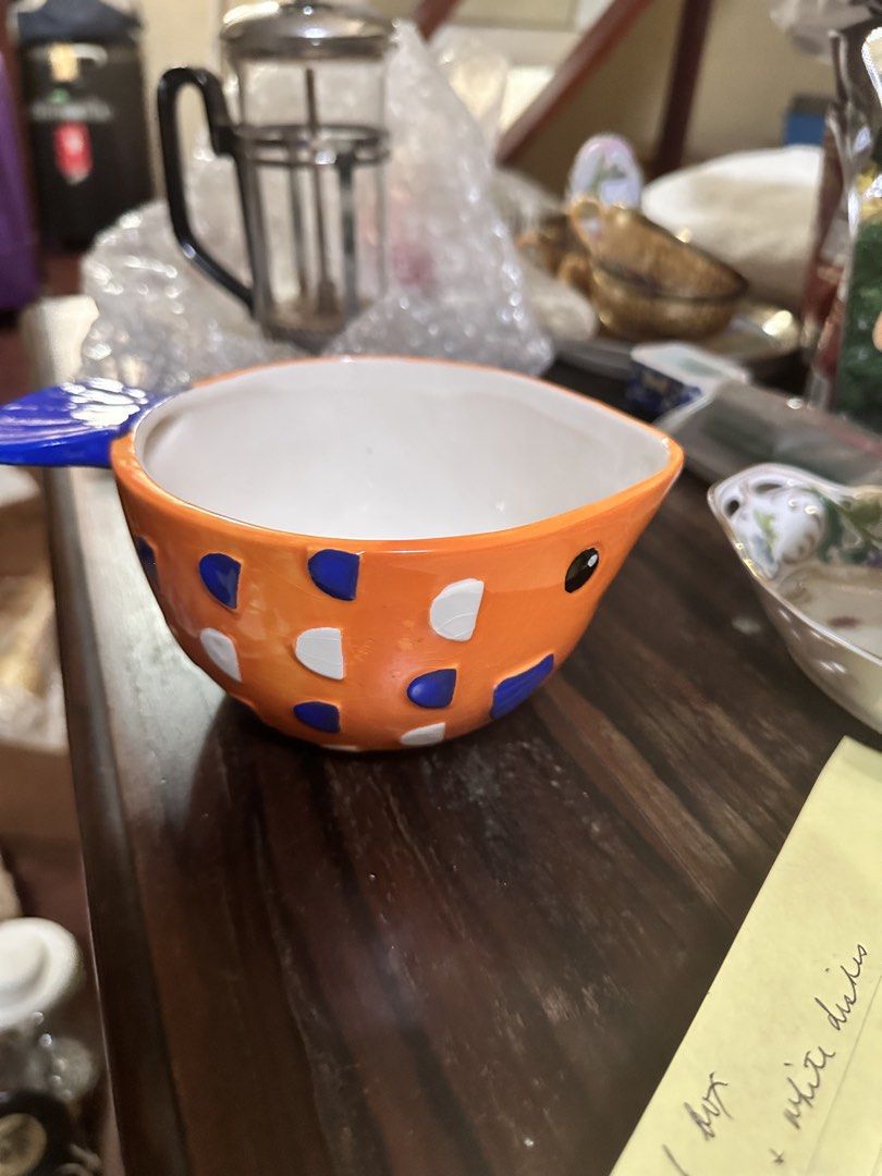 Orange Fish-Shaped Bowl (Category: Other Kitchenware & Tableware) located in Quezon City. Submitted by mystictiger.019d9c (Listing ID 1439251709, Image 1). Description: - Fish-shaped bowl - Vibrant orange exterior with white and blue accents - White interior - Ideal for serving snacks - Perfect as a decorative piece - Charming addition to your kitchen or display.