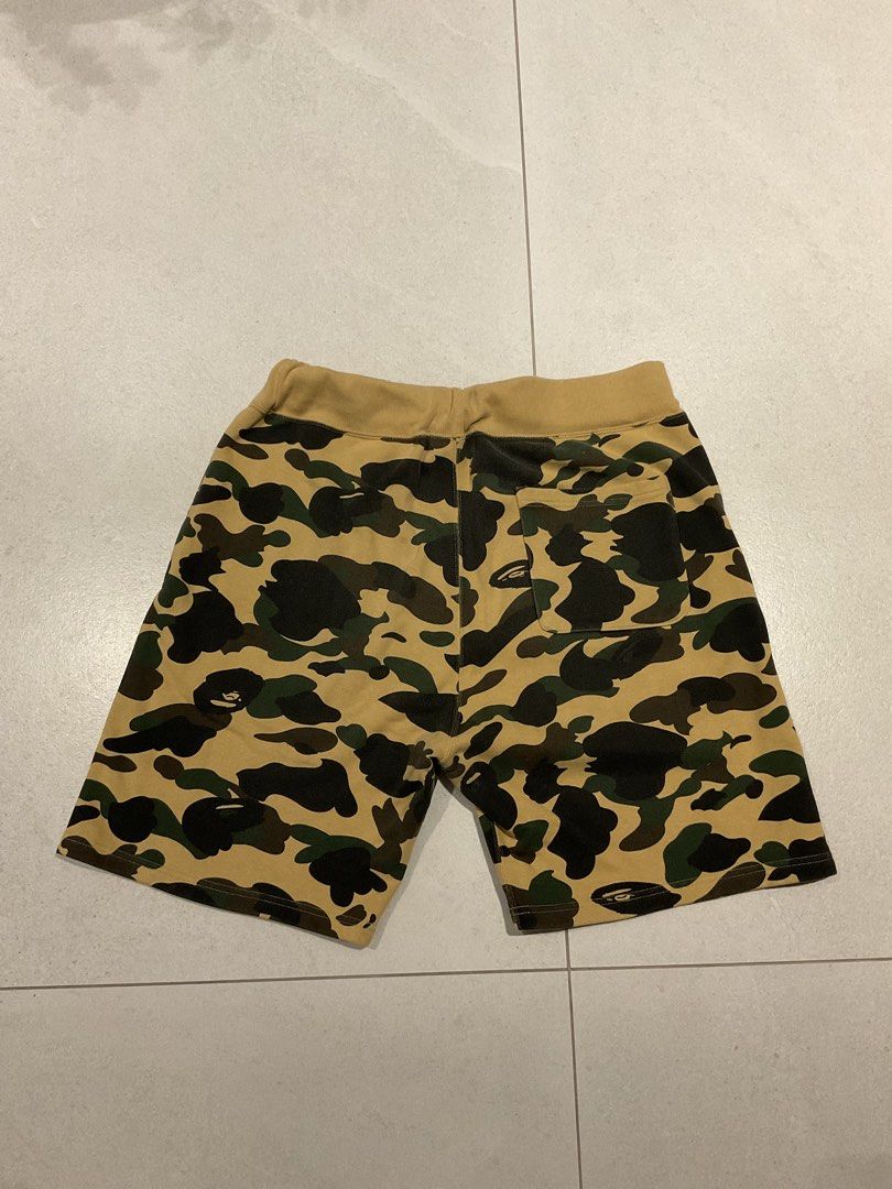 Original BAPE Shark Shorts (Category: Shorts) located in Quezon City. Submitted by aguilartam12610 (Listing ID 1439349200, Image 3). Description: Original BAPE Shark Shorts in yellow camo. Size XL. Features the iconic shark face design, drawstring waist, and back pocket..