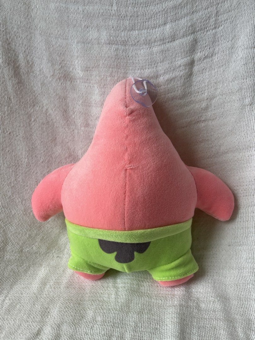 Patrick Star Plush Toy (Category: Plushies & Soft Toys) located in Manila. Submitted by prima_onda (Listing ID 1439294051, Image 3). Description: - Adorable Patrick Star plush. - Features Patrick's iconic pink color and green shorts. - Includes a convenient hanging loop. - Perfect for collectors and fans of the show. - Price is for each item. Buy more for larger discount! ⭐️ - Soft and huggable!.