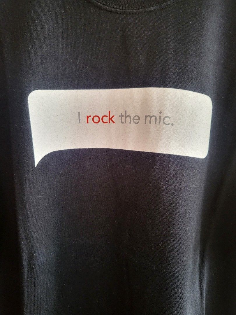 Playstation 2 Singstar T-shirt (Category: Tshirts & Polo Shirts ) located in Bulacan. Submitted by waybak90s (Listing ID 1439318460, Image 2). Description: - PlayStation 2 promotional t-shirt - Features "I rock the mic" and "Singstar Rocks!" graphics - Includes a "Playstation.2" logo on the sleeve - Classic round neck design - Short sleeves - Likely made of cotton.