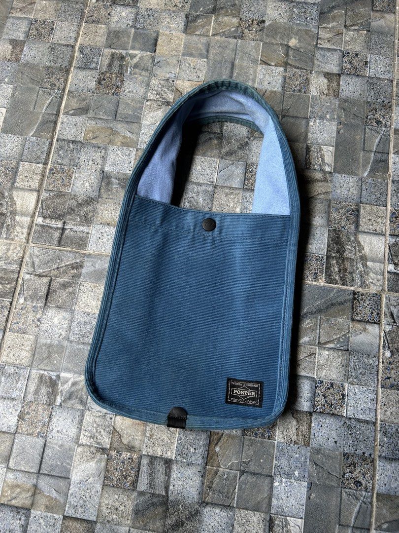 Porter Corduroy Tote Bag (Category: Tote Bags) located in Quezon City. Submitted by commonwealthpickerph (Listing ID 1439308561, Image 2). Description: Porter Corduroy Tote Bag - 7 width // 8.5 length - Corduroy material - Single button closure - Comfortable shoulder strap - Rectangular shape with rounded corners - Porter logo visible - Light blue interior lining - Perfect for everyday use - in excellent condition - need wash .
