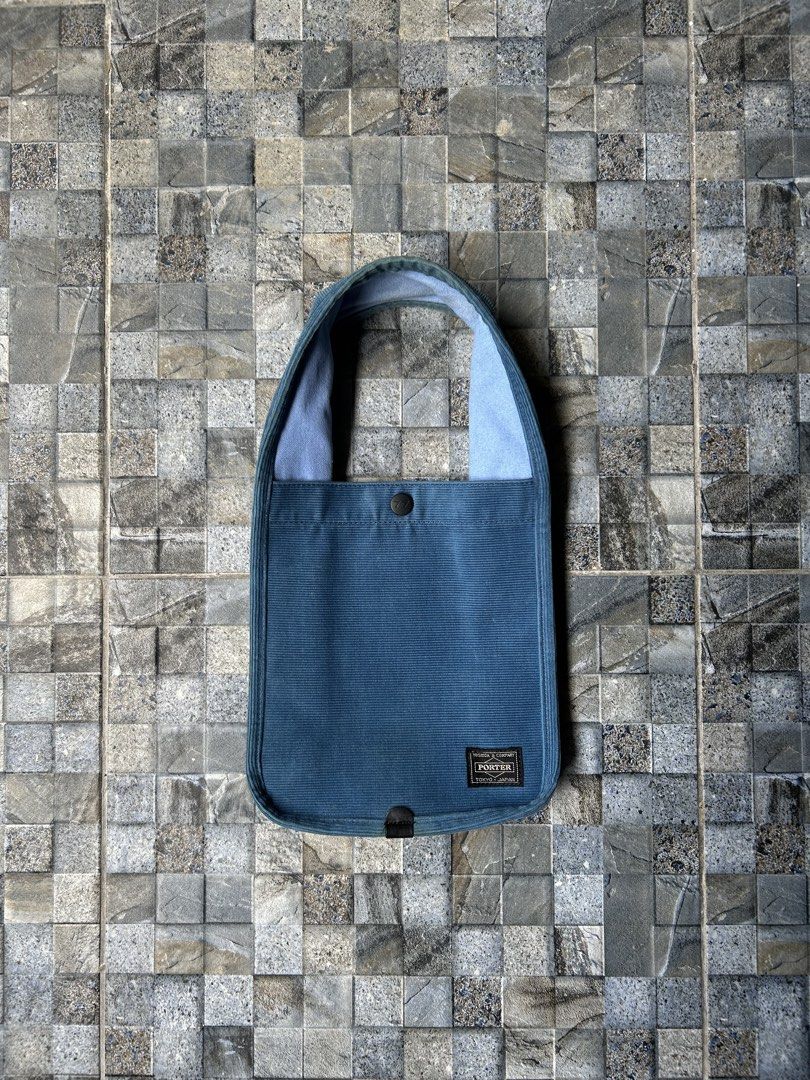 Porter Corduroy Tote Bag (Category: Tote Bags) located in Quezon City. Submitted by commonwealthpickerph (Listing ID 1439308561, Image 1). Description: Porter Corduroy Tote Bag - 7 width // 8.5 length - Corduroy material - Single button closure - Comfortable shoulder strap - Rectangular shape with rounded corners - Porter logo visible - Light blue interior lining - Perfect for everyday use - in excellent condition - need wash .