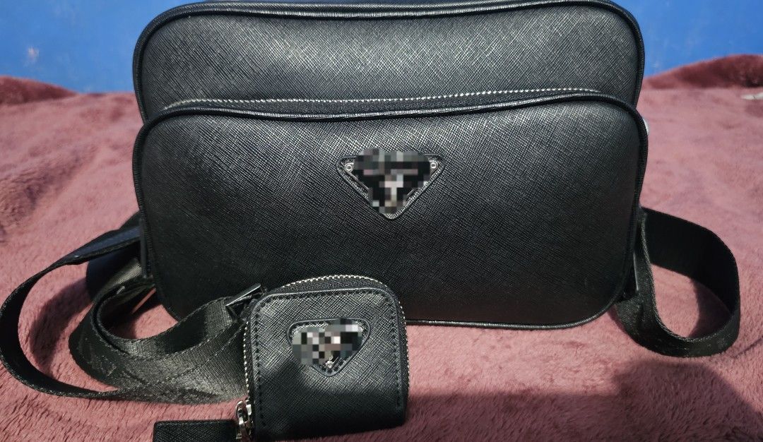 PRADA MESSENGER BAG (Category: Luxury Bags & Wallets) located in Manila. Submitted by maria.greys017 (Listing ID 1439287859, Image 3). Description: Prada Saffiano leather shoulder bag with detachable pouch * Almost new (used - Twice) *Japan sourced per seller Product Details: • Material: leather • Lining: leather • Made in Italy • Color: black • Designer color name: Ivory Glow • Item color: black • Detachable zipped pouch • Internal details: slot