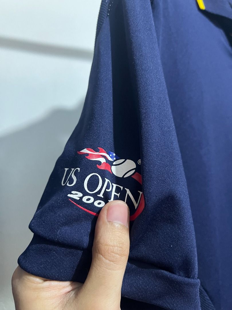 Ralph Lauren US Open Polo Shirt (Category: Tshirts & Polo Shirts ) located in Quezon City. Submitted by don.fitss (Listing ID 1439354608, Image 3). Description: - Navy blue Ralph Lauren polo shirt - Yellow collar - Mesh detailing on shoulders - US Open 2008 logo on left sleeve - Button-down collar - Athletic design.