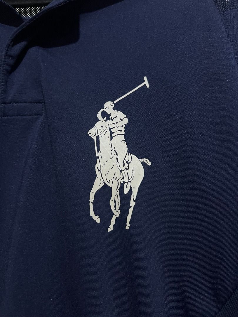 Ralph Lauren US Open Polo Shirt (Category: Tshirts & Polo Shirts ) located in Quezon City. Submitted by don.fitss (Listing ID 1439354608, Image 2). Description: - Navy blue Ralph Lauren polo shirt - Yellow collar - Mesh detailing on shoulders - US Open 2008 logo on left sleeve - Button-down collar - Athletic design.
