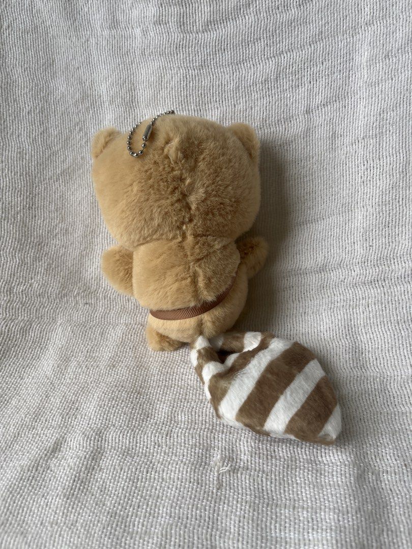Red Panda Plushie with Camera (Category: Plushies & Soft Toys) located in Manila. Submitted by prima_onda (Listing ID 1439294095, Image 2). Description: - Adorable red panda plushie - Features a camera - Brown and white striped tail - Includes a small strap - Comes with a keychain - Soft and fluffy.