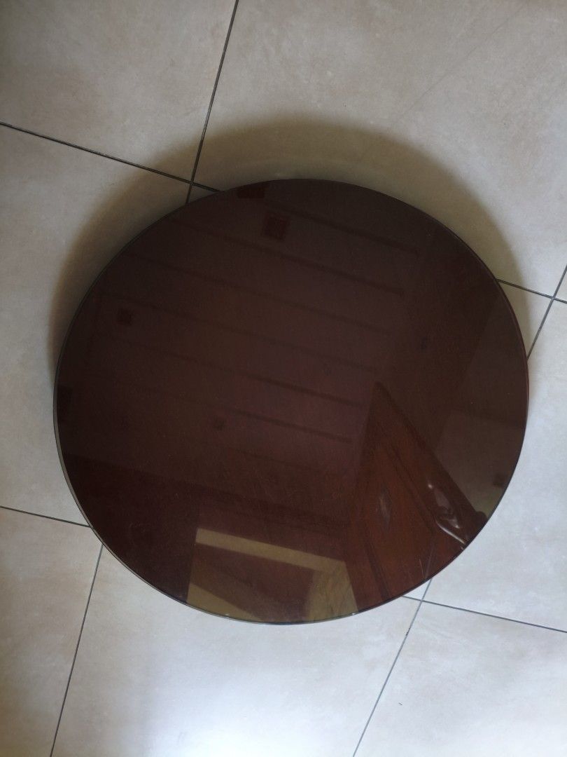 Round Dark Brown Table Top (Category: Tables & Sets) located in Manila. Submitted by joe.kelly (Listing ID 1439333470, Image 2). Description: - Round table top - Dark brown, glossy finish - Wooden frame - Ito po un pinapaikot sa taas ng round dining table includes glass diameter : 2 feet 6 inches Location: Sct madrinan, south triangle, Quezon city .