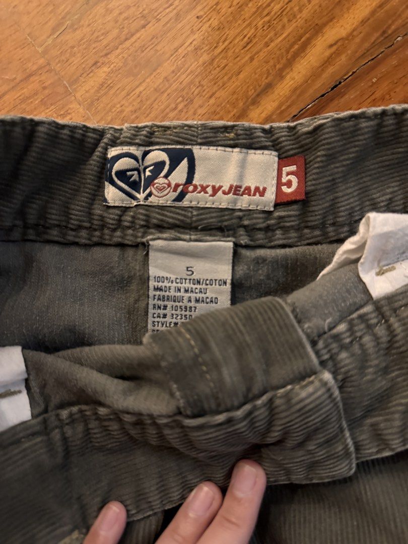 Roxy Jean Corduroy Shorts Size 5 (Category: Shorts) located in Quezon City. Submitted by shoppingaddict444 (Listing ID 1439397503, Image 2). Description: - Roxy Jean corduroy shorts - Muted green color - Size 5 (waist 25-26) - Button closure - Two front pockets with button details - Made in Macau - Corduroy fabric - Classic, casual style.