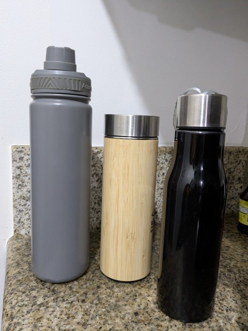 Set of Three Water Bottles (Category: Water Bottles & Tumblers) located in Mandaluyong City. Submitted by sasheemi (Listing ID 1439399595, Image 1). Description: Take all Listing includes three water bottles. - gray insulated bottle with a flip-top lid. - bamboo-style bottle with a stainless steel top - black, sleek bottle with a stainless steel lid..