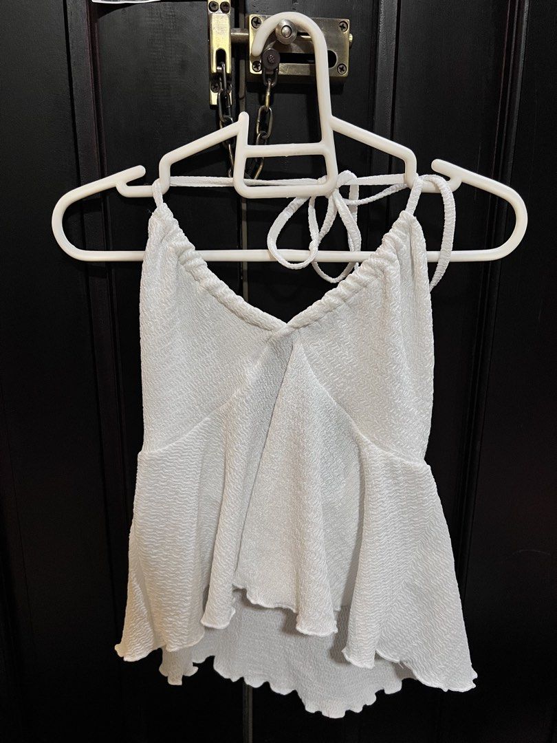SHEIN White Tie Halter Loose Top (Category: Sleeveless) located in Manila. Submitted by newtlaufeyson (Listing ID 1439326526, Image 1). Description: - SHEIN - Size XS - Only worn once - White loose halter top .