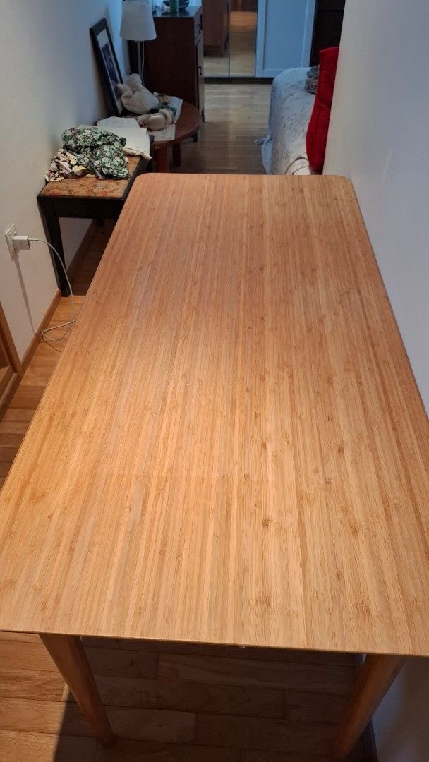 Solid wood table (Category: Tables & Sets) located in Singapore. Submitted by neevybee (Listing ID 1439251777, Image 3). Description: - Ikea ( Lisabo) - Light wood finish (Ash veneer) - Tapered legs - Solid construction.