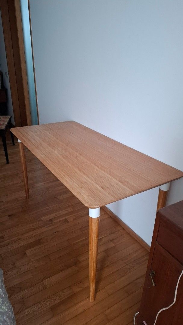 Solid wood table (Category: Tables & Sets) located in Singapore. Submitted by neevybee (Listing ID 1439251777, Image 2). Description: - Ikea ( Lisabo) - Light wood finish (Ash veneer) - Tapered legs - Solid construction.