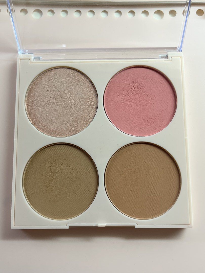 Squad Contour and Blush Palette (Category: Makeup) located in Cavite. Submitted by hiimclover (Listing ID 1439361032, Image 2). Description: Tried twice only - Squad palette with blush, bronzer, highlighter, and contour. - Includes four shades. - Compact, clear case. - Net weight: 20g. - Expiration date: 2030. - Ingredients and usage details on the back..