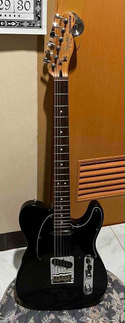 Squier by Fender Telecaster Standard Series (Category: Musical Instruments) located in Taguig. Submitted by dibsssssss (Listing ID 1439312993, Image 1). Description: - Squier by Fender Telecaster Standard Series - Black body with chrome hardware - Maple neck - Classic Telecaster design - Two pickups - Includes a pick.