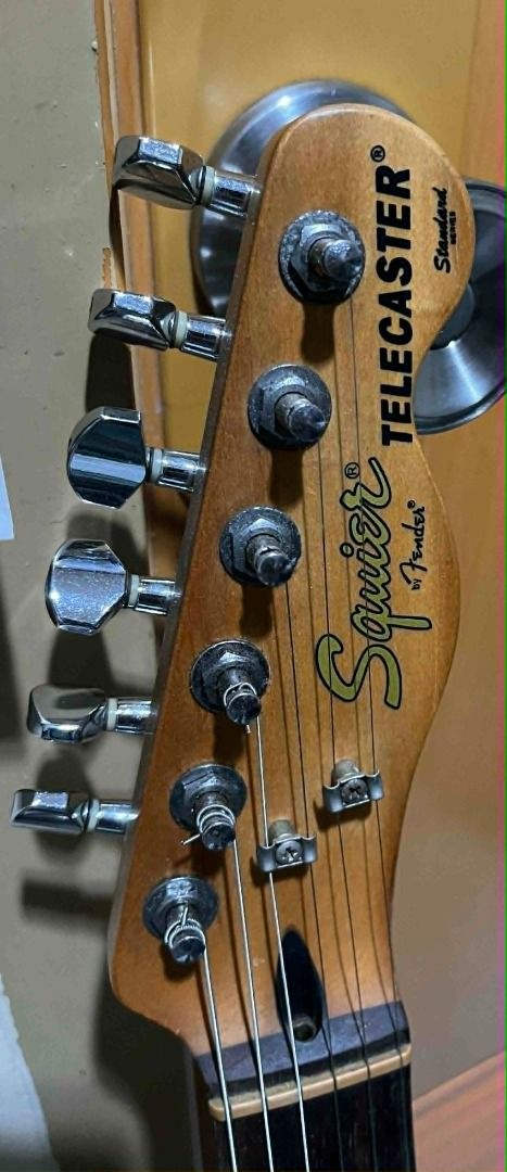 Squier by Fender Telecaster Standard Series (Category: Musical Instruments) located in Taguig. Submitted by dibsssssss (Listing ID 1439312993, Image 2). Description: - Squier by Fender Telecaster Standard Series - Black body with chrome hardware - Maple neck - Classic Telecaster design - Two pickups - Includes a pick.