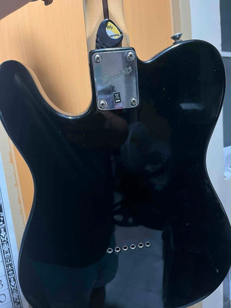 Squier by Fender Telecaster Standard Series (Category: Musical Instruments) located in Taguig. Submitted by dibsssssss (Listing ID 1439312993, Image 3). Description: - Squier by Fender Telecaster Standard Series - Black body with chrome hardware - Maple neck - Classic Telecaster design - Two pickups - Includes a pick.