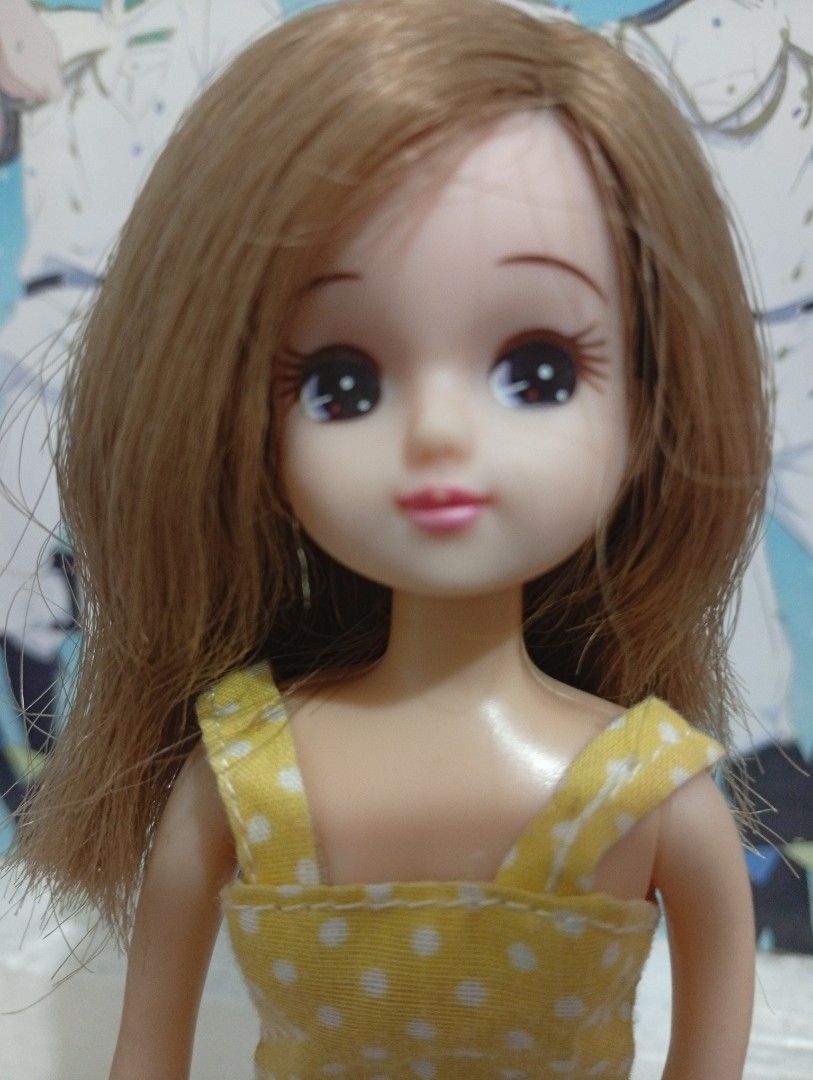 Takara Licca Chan doll (Category: Figurines & Statues) located in Manila. Submitted by thecraft240 (Listing ID 1439296152, Image 2). Description: - Yellow dress with white polka dots.White apron with lace detailing - stand Not included -joints wires still bend flaws Lip chip possible haircut .