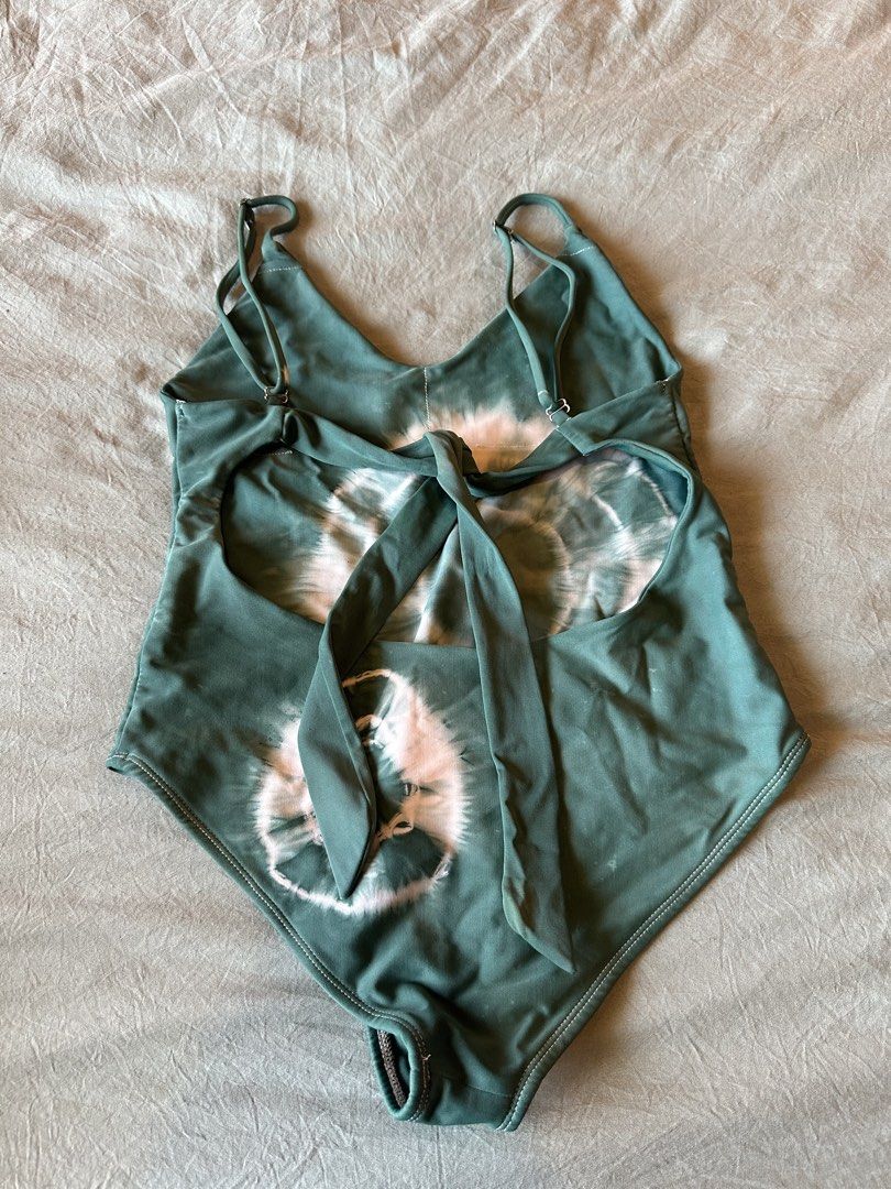 Tie-dye Green One-piece Swimsuit (Category: Bikinis & Swimsuits) located in Taguig. Submitted by adelledeclutters (Listing ID 1439273031, Image 2). Description: - Tie-dye one-piece swimsuit - Green and pink color scheme - Adjustable straps - Low back with tie closure - V-neckline - Flattering cut - Ideal for beach or pool days.