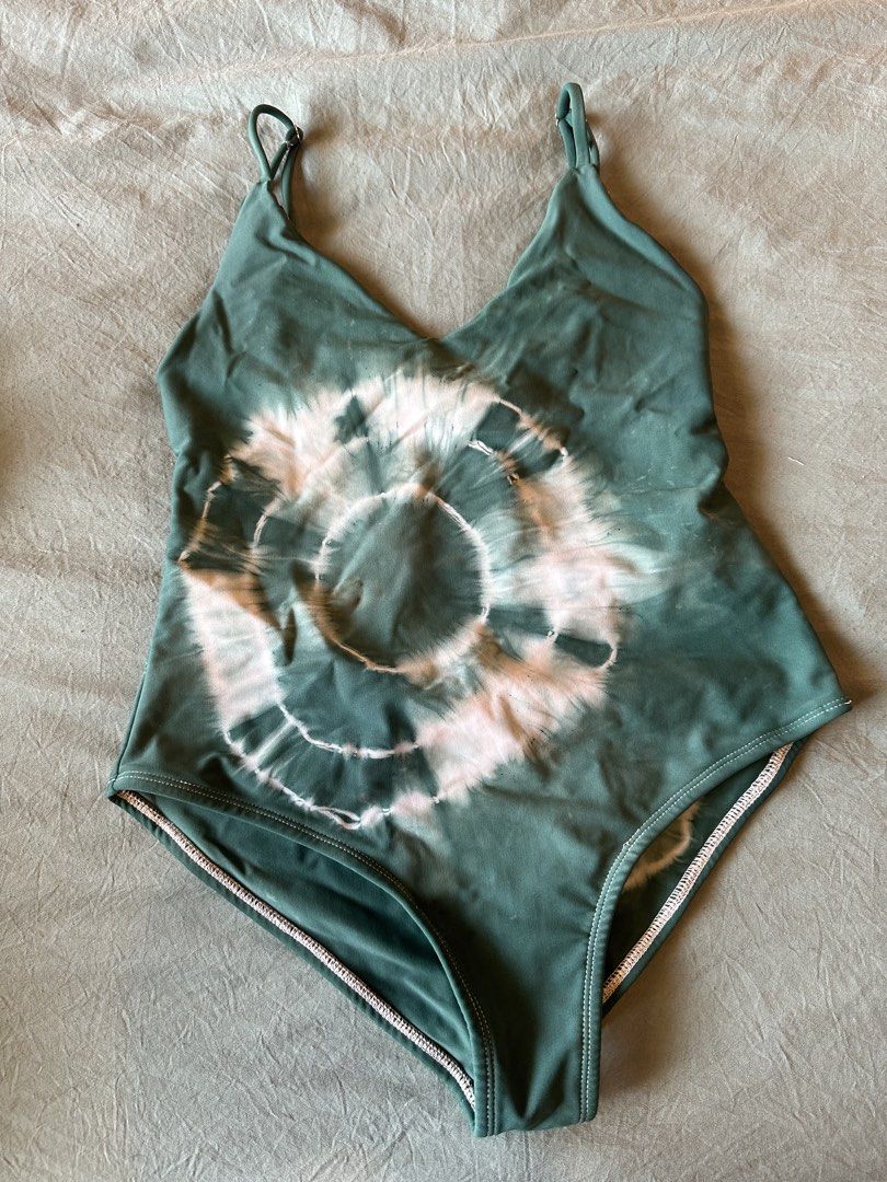 Tie-dye Green One-piece Swimsuit (Category: Bikinis & Swimsuits) located in Taguig. Submitted by adelledeclutters (Listing ID 1439273031, Image 1). Description: - Tie-dye one-piece swimsuit - Green and pink color scheme - Adjustable straps - Low back with tie closure - V-neckline - Flattering cut - Ideal for beach or pool days.