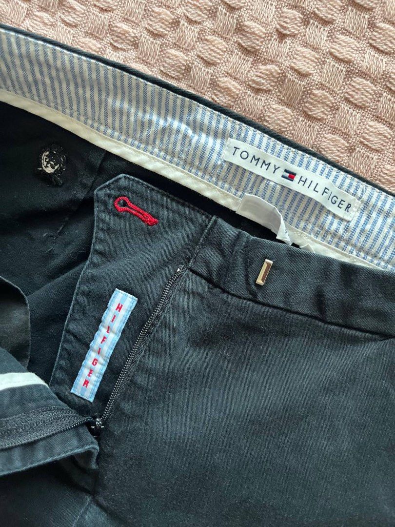 Tommy Hilfiger Cropped Pants Size 30 (Category: Jeans) located in Mandaluyong City. Submitted by beangoose (Listing ID 1439402350, Image 2). Description: - Tommy Hilfiger cropped pants - Classic button and zipper closure - Tailored fit - Subtle striped waistband detail - Made from durable fabric - Suitable for various occasions - A versatile wardrobe addition.