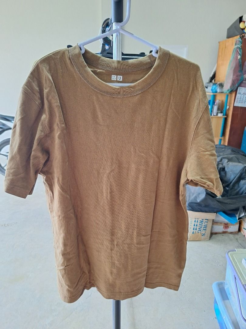 Uniqlo Brown T-shirt (Category: Tshirts & Polo Shirts ) located in Malaybalay. Submitted by mags_sofia (Listing ID 1439377220, Image 1). Description: - Uniqlo brown t-shirt - Crew neck - Short sleeves - Textured fabric - Simple and casual design - Suitable for everyday wear - Solid color for easy matching MOP: GCash, BPI Transfer MOD: LBC COP (SF is paid upon pickup); J&T (initial payment is 100 pesos; increment and decrement are processed after 