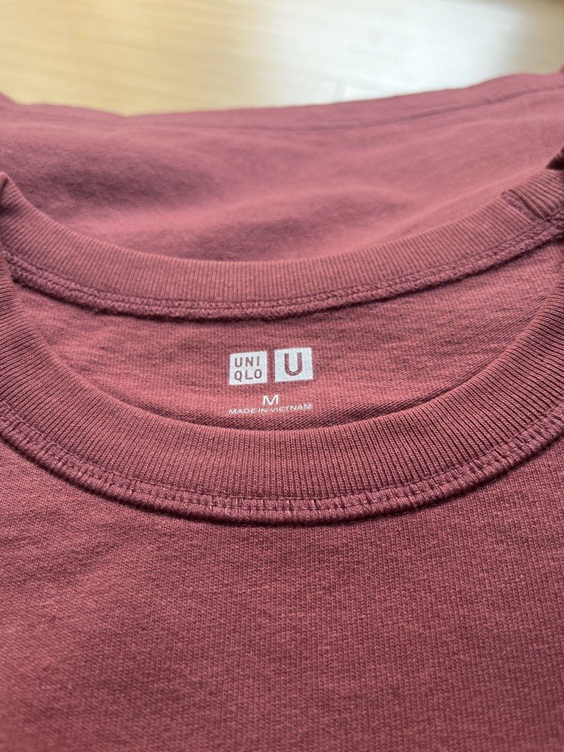 Uniqlo Crew Neck T-shirt - Medium (Category: Tshirts & Polo Shirts ) located in Manila. Submitted by kenjiang1 (Listing ID 1439273268, Image 2). Description: - Uniqlo crew neck t-shirt - Size: Medium - Made in Vietnam - Color: Reddish-brown - Design: Classic, short-sleeved - Features the Uniqlo logo.