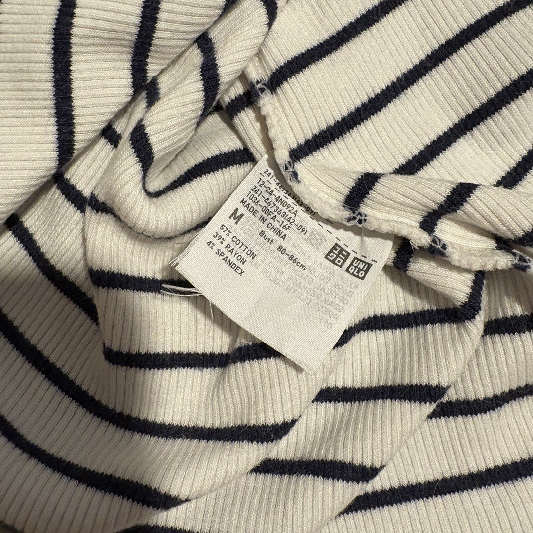 Uniqlo Striped T-shirt - Medium (Category: Shirts) located in Manila. Submitted by icy_________ (Listing ID 1439289497, Image 3). Description: - Uniqlo striped t-shirt - Size: Medium - Color: White with navy blue stripes - Fabric: Ribbed knit - Neckline: Round - Sleeves: Short - Material: Cotton, rayon, spandex.