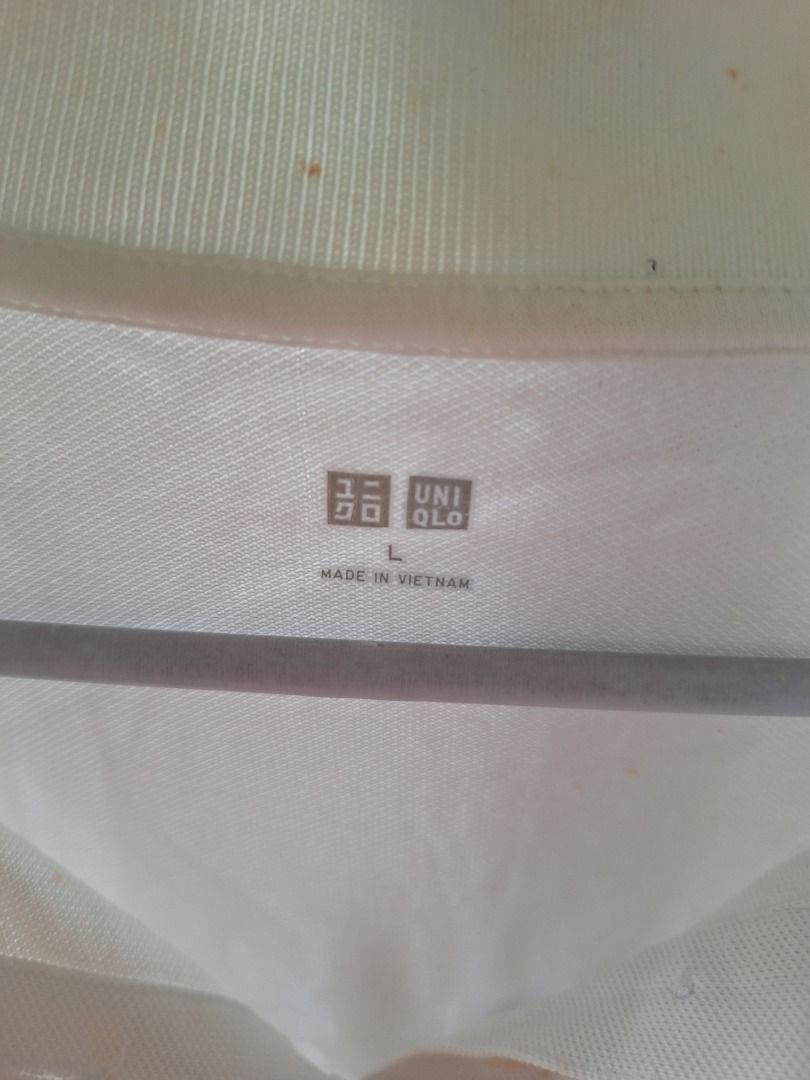 Uniqlo White Polo Shirt (Category: Tshirts & Polo Shirts ) located in Malaybalay. Submitted by mags_sofia (Listing ID 1439375352, Image 3). Description: - Features: Classic collar, short sleeves, v-neck - Material: Polyester-cotton blend - Made in Vietnam - Condition: Visible stains MOP: GCash, BPI Transfer MOD: LBC COP (SF is paid upon pickup); J&T (initial payment is 100 pesos; increment and decrement are processed after item is shipped) SF: c/