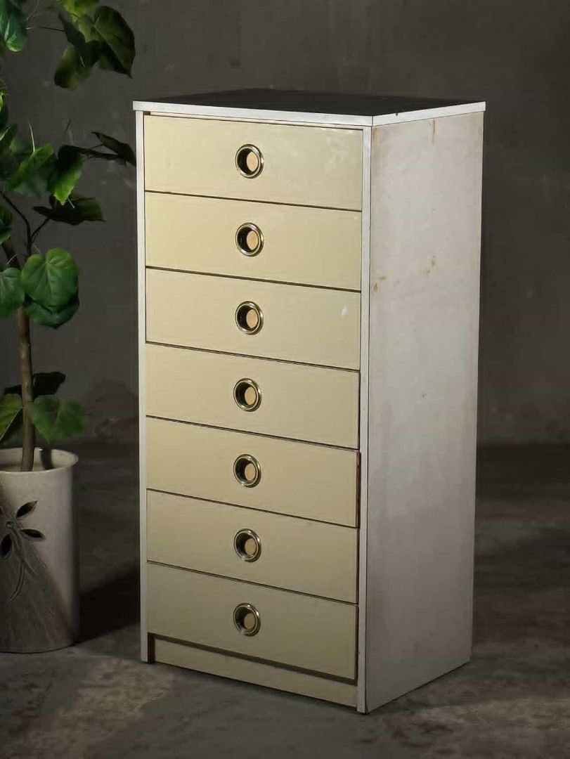 Vintage 7-Drawer Dresser (Category: Shelves, Cabinets & Racks) located in Valenzuela. Submitted by upcycle_things (Listing ID 1439368256, Image 3). Description: - Vintage dresser - Seven drawers for ample storage - Stylish brass-toned circular handles - Light cream-colored drawers - Neutral-toned frame - Tall and narrow design, ideal for smaller spaces - Made of wood.