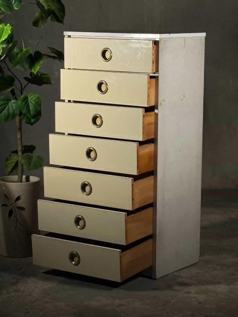 Vintage 7-Drawer Dresser (Category: Shelves, Cabinets & Racks) located in Valenzuela. Submitted by upcycle_things (Listing ID 1439368256, Image 1). Description: - Vintage dresser - Seven drawers for ample storage - Stylish brass-toned circular handles - Light cream-colored drawers - Neutral-toned frame - Tall and narrow design, ideal for smaller spaces - Made of wood.