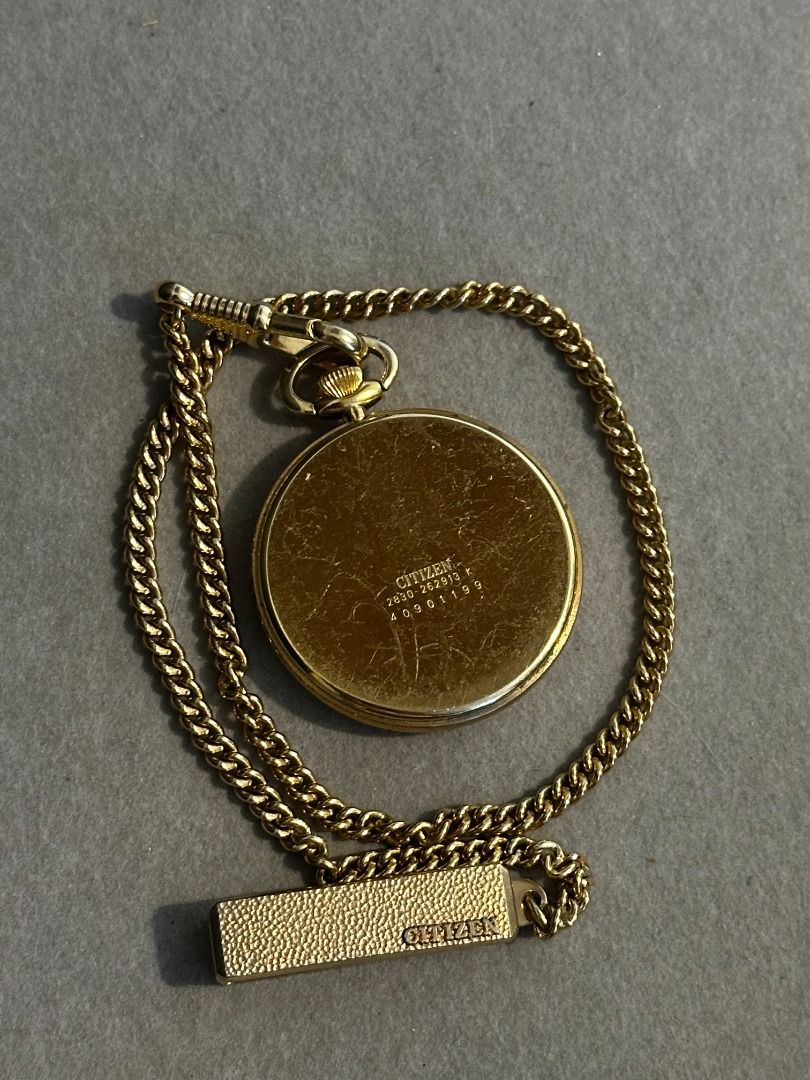 Vintage Citizen Quartz Pocket Watch (Category: Accessory Holder, Box & Organizers) located in Cavite. Submitted by .billy (Listing ID 1439332241, Image 2). Description: Era: Late 1980s – early 1990s Movement: Quartz (Japan) Case Size (Watch Head): 36.3 mm Reference / Markings: 2830-262913 K / 40901199 Details: Citizen pocket watch with Japanese quartz movement Gold-tone case with matching pocket chain White dial with Arabic numeral hour markers C