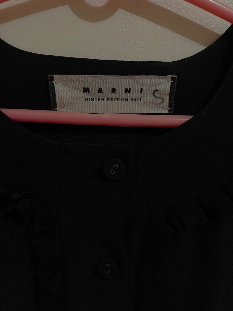 Marni Winter Edition 2011 Silk Ruffle Button-Up Front Dress (Category: Luxury Apparel) located in San Jacinto. Submitted by lovedbylou.ph (Listing ID 1439291180, Image 2). Description: •with pockets •silk top; wool and cotton bottom •will definitely keep if no one wants it. Let me know your price ✨.