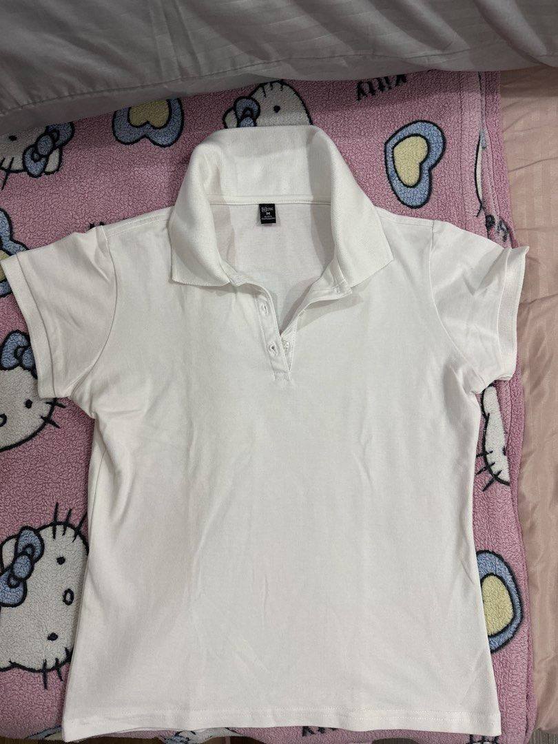 White Polo Shirt (Category: Tshirts & Polo Shirts ) located in Manila. Submitted by sunschra (Listing ID 1439347892, Image 1). Description: - White polo shirt - Short sleeves - Collared neckline - Three-button closure - Soft, lightweight fabric - Perfect for casual wear - Versatile design.