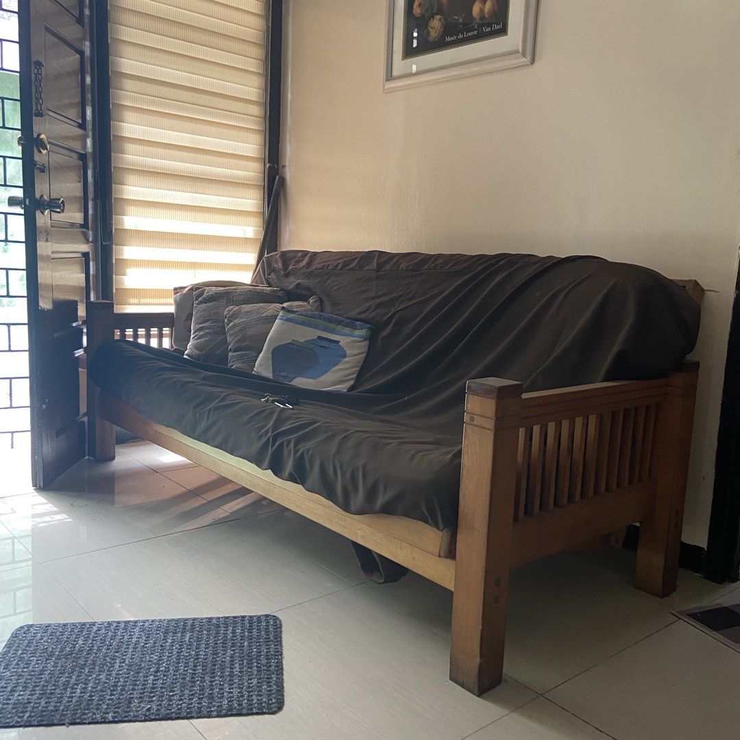 Wooden Futon Sofa Bed (Category: Bed Frames & Mattresses) located in Paranaque City. Submitted by furniture_seller_jay (Listing ID 1439268766, Image 1). Description: Imported from the US wooden sofa bed - Wooden futon sofa bed - Brown mattress cover - Includes throw pillows - Wooden frame - Converts into a bed - Ideal for living rooms or guest rooms.