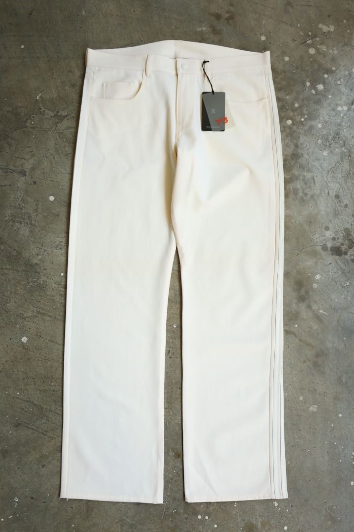 Y-3 - S/S 04 - Three Stripe Trousers (Category: Trousers) located in Manila. Submitted by graymatter_ (Listing ID 1439347077, Image 2). Description: Y-3 - S/S 04 - Three Stripe Trousers Tagged Size: M Condition: BN w/ Tags Flaws: Yellow Dot Stains Material: 98% Lana Wool, 2% Polyurethane Made in: China Dimensions Waist: 37 Inseam: 33 Crotch: 12.5 Thigh: 13 Leg Opening: 9.5 .