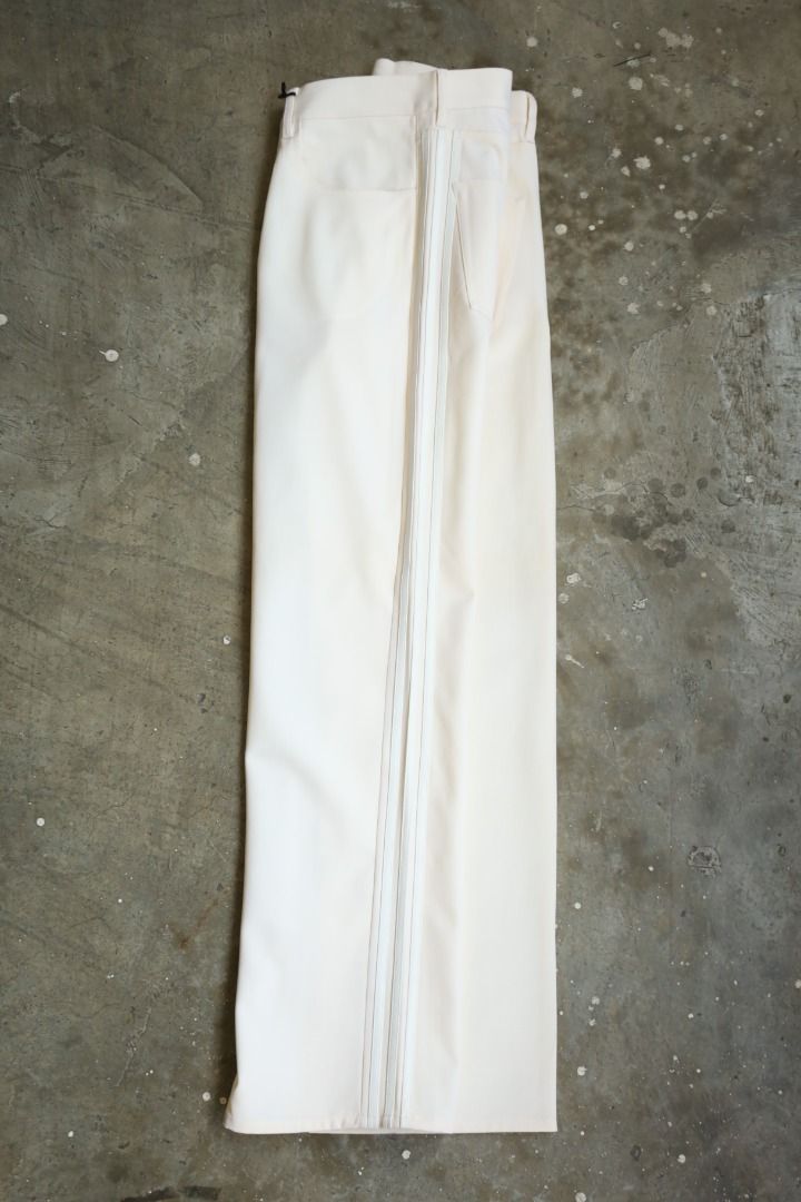 Y-3 - S/S 04 - Three Stripe Trousers (Category: Trousers) located in Manila. Submitted by graymatter_ (Listing ID 1439347077, Image 1). Description: Y-3 - S/S 04 - Three Stripe Trousers Tagged Size: M Condition: BN w/ Tags Flaws: Yellow Dot Stains Material: 98% Lana Wool, 2% Polyurethane Made in: China Dimensions Waist: 37 Inseam: 33 Crotch: 12.5 Thigh: 13 Leg Opening: 9.5 .