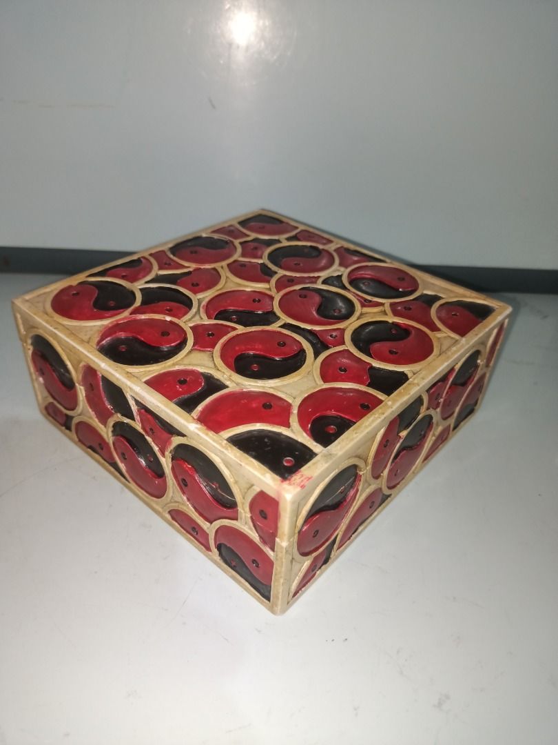Yin Yang Decorative Soapstone Box (Category: Storage Boxes & Baskets) located in Munoz. Submitted by larryc1212 (Listing ID 1439391779, Image 1). Description: - Square decorative box - Features a Yin Yang design - Red and black exterior - Light brown interior - Approximately 2.5 inches tall - Approximately 6 inches wide - Issue: with minor dents due to age Disclaimer: Item may include some scratches due to age, as is were is basis Item can be pic