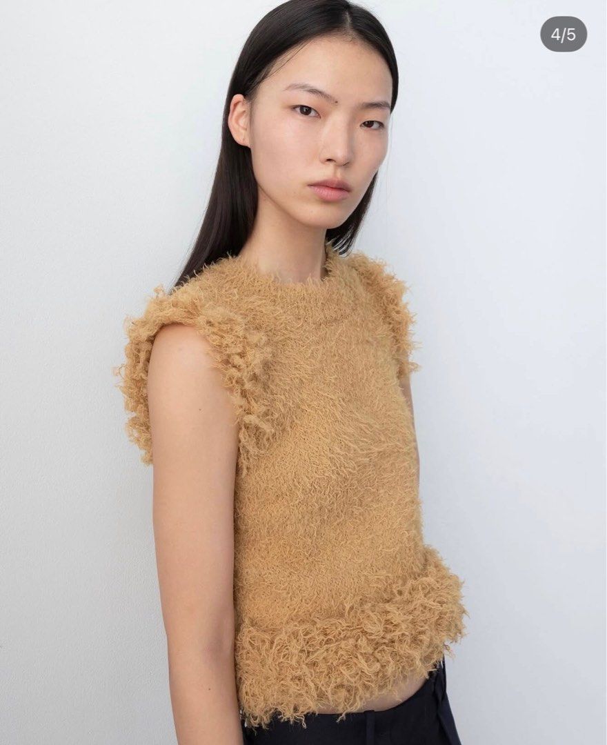 Zara Fuzzy Knit Vest (Category: Blouses) located in Makati City. Submitted by shopbb (Listing ID 1439385229, Image 1). Description: Rarely used top Size M on tag Size runs small so I got it in Medium .