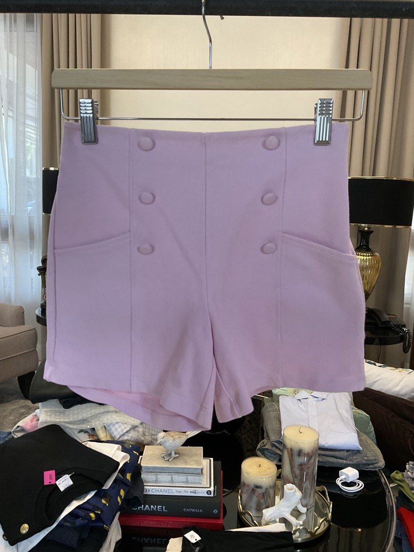 Zara Pink High-Waisted Shorts (Category: Babies & Kids Fashion) located in Antipolo. Submitted by ibyangs_closet (Listing ID 1439284350, Image 1). Description: These stylish pink shorts from Zara feature a high-waisted design with decorative buttons. They have an elastic waistband for a comfortable fit. The shorts are a light pink color and appear to be made of a smooth fabric. The size is indicated as 11-12, corresponding to a CM size of 152. Ma