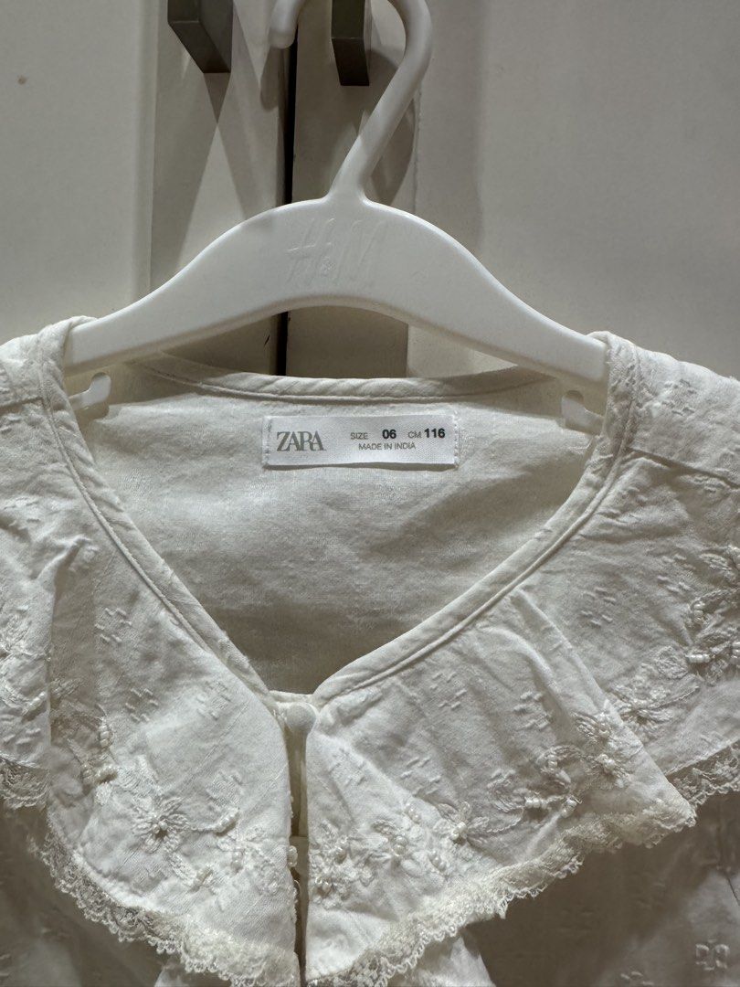 Zara White Embroidered Blouse 6 years old (Category: Babies & Kids Fashion) located in Quezon City. Submitted by Tasi671 (Listing ID 1439289540, Image 3). Description: - Zara white blouse - Embroidered details - Ruffled collar - Button-down front - Long sleeves - Size 6 (fits 116cm) - Made in India.