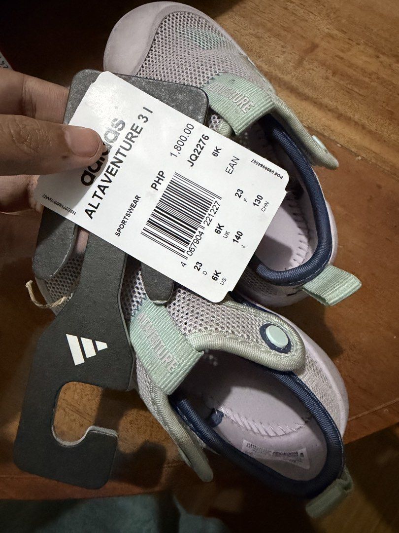 Adidas AltaVenture 3.1 Sandals (Category: Babies & Kids Fashion) located in Mandaluyong City. Submitted by jenvm (Listing ID 1439495309, Image 2). Description: Adidas AltaVenture 3.1 sandals. Features a mesh upper and adjustable straps. The sandals are in a light color scheme with blue and mint green accents. The soles have the Adidas logo and are designed for grip. The original price tag is still attached, showing the price in PHP..