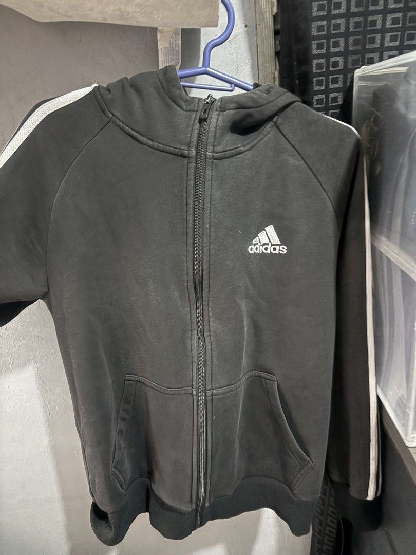 Adidas Black Zip-Up Hoodie Jacket (Category: Coats, Jackets and Outerwear) located in Marikina City. Submitted by lily.ca (Listing ID 1439600323, Image 2). Description: - Adidas black zip-up hoodie jacket - White stripes on sleeves - Front zipper closure - Two front pockets - Adidas logo on chest - Size: L - Features Climalite technology - Classic design - Ideal for casual wear Hindi na naalis zipper nya.